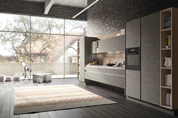 cucina con piano e mobili in cemento